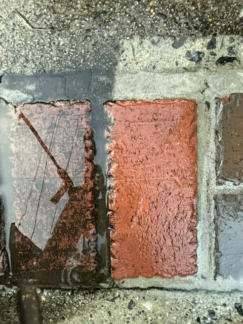 Brick paver half cleaned