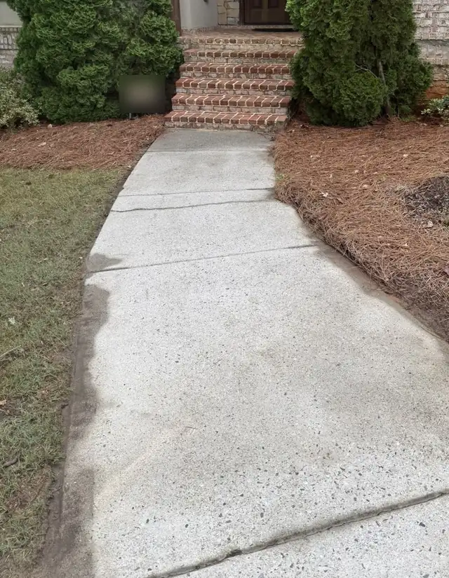 Front walkway after pressure washing, bright clean concrete